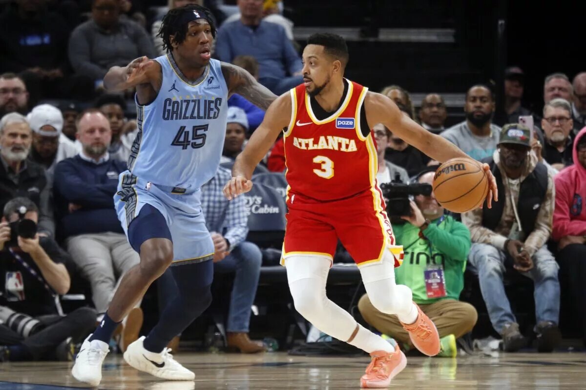 Jan 21, 2026; Memphis, Tennessee, USA; Atlanta Hawks guard CJ McCollum (3) dribbles as Memphis Grizzlies forward GG Jackson II (45) defends during the third quarter at FedExForum. Mandatory Credit: Petre Thomas-Imagn Images