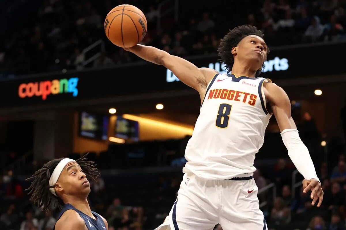 Jan 22, 2026; Washington, District of Columbia, USA; Denver Nuggets guard Peyton Watson (8) attempts a dunk over Washington Wizards guard Tre Johnson (12) during the second half at Capital One Arena. Mandatory Credit: Daniel Kucin Jr.-Imagn Images