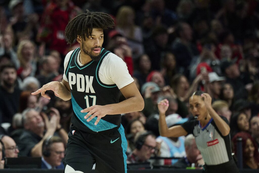  Portland Trail Blazers guard Shaedon Sharpe (17) celebrates scoring a three point basket during the second half against the Miami Heat at Moda Center.