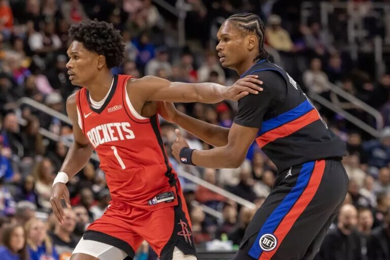 Detroit Pistons guard Ausar Thompson (9) defends against his twin brother, Houston Rockets guard Amen Thompson (1) during the first half at Little Caesars Arena.