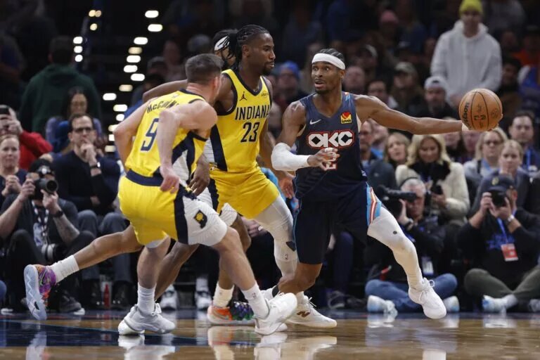 Jan 23, 2026; Oklahoma City, Oklahoma, USA; Oklahoma City Thunder guard Shai Gilgeous-Alexander (2) moves the ball around Indiana Pacers guard/forward Aaron Nesmith (23) during the second half at Paycom Center. Mandatory Credit: Alonzo Adams-Imagn Images