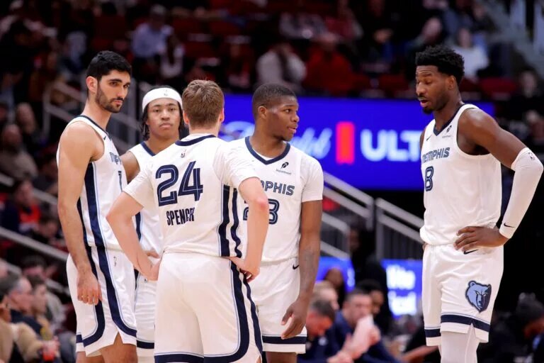 Memphis Grizzlies players communicating on court