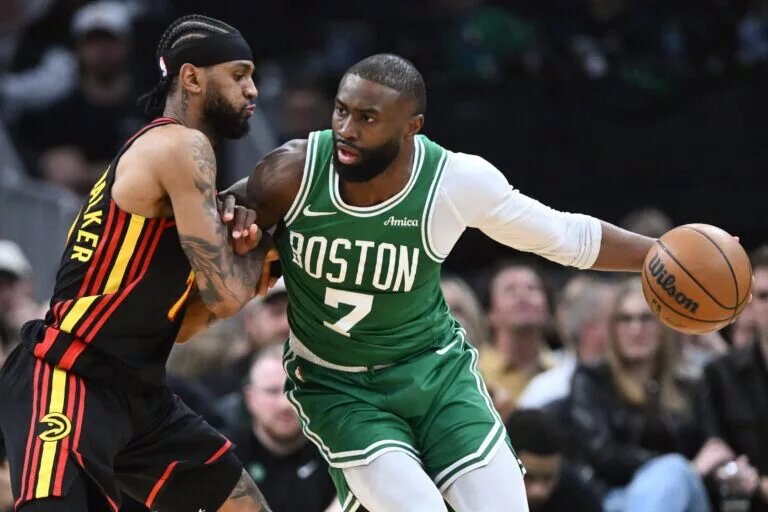 Boston Celtics guard Jaylen Brown (7) drives to the basket against Atlanta Hawks guard Nickeil Alexander-Walker (7) during the first half at the TD Garden.