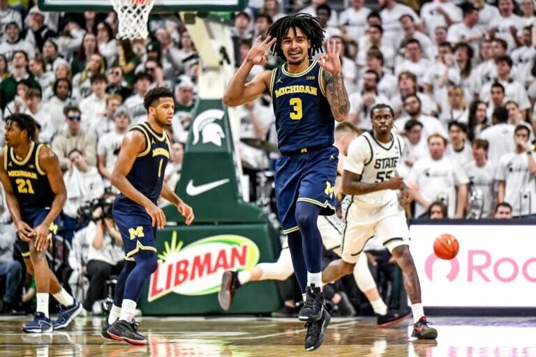 Michigan's Elliot Cadeau celebrates after making a 3-pointer against Michigan State during the second half on Friday, Jan. 30, 2026, at the Breslin Center in East Lansing.