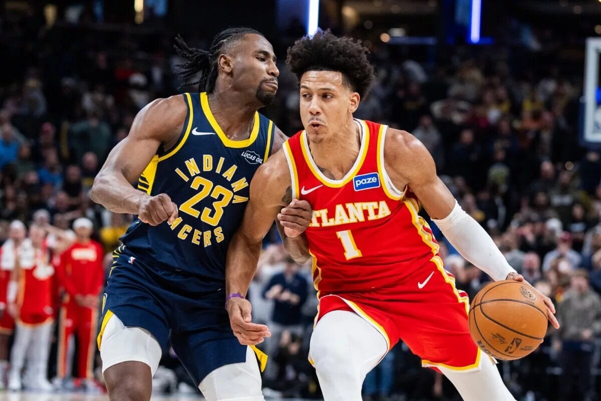 Jan 31, 2026; Indianapolis, Indiana, USA; Atlanta Hawks forward Jalen Johnson (1) dribbles the ball while Indiana Pacers guard/forward Aaron Nesmith (23) defends in the second half at Gainbridge Fieldhouse. Mandatory Credit: Trevor Ruszkowski-Imagn Images