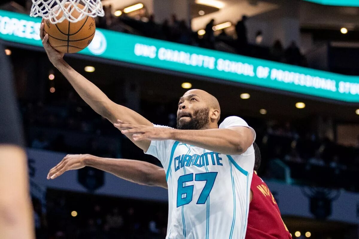 Mar 7, 2025; Charlotte, North Carolina, USA; Charlotte Hornets forward Taj Gibson (67) shoots against the Cleveland Cavaliers during the first quarter at Spectrum Center. Mandatory Credit: Scott Kinser-Imagn Images