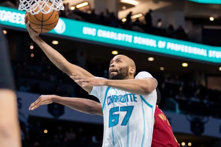 Mar 7, 2025; Charlotte, North Carolina, USA; Charlotte Hornets forward Taj Gibson (67) shoots against the Cleveland Cavaliers during the first quarter at Spectrum Center. Mandatory Credit: Scott Kinser-Imagn Images