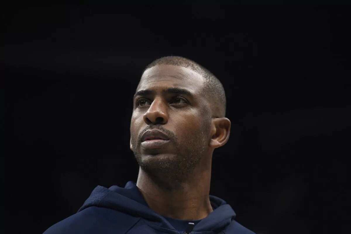 Nov 22, 2025; Charlotte, North Carolina, USA; Los Angeles Clippers guard Chris Paul (3) in a time out during the first half against the Charlotte Hornets at the Spectrum Center. Mandatory Credit: Sam Sharpe-Imagn Images