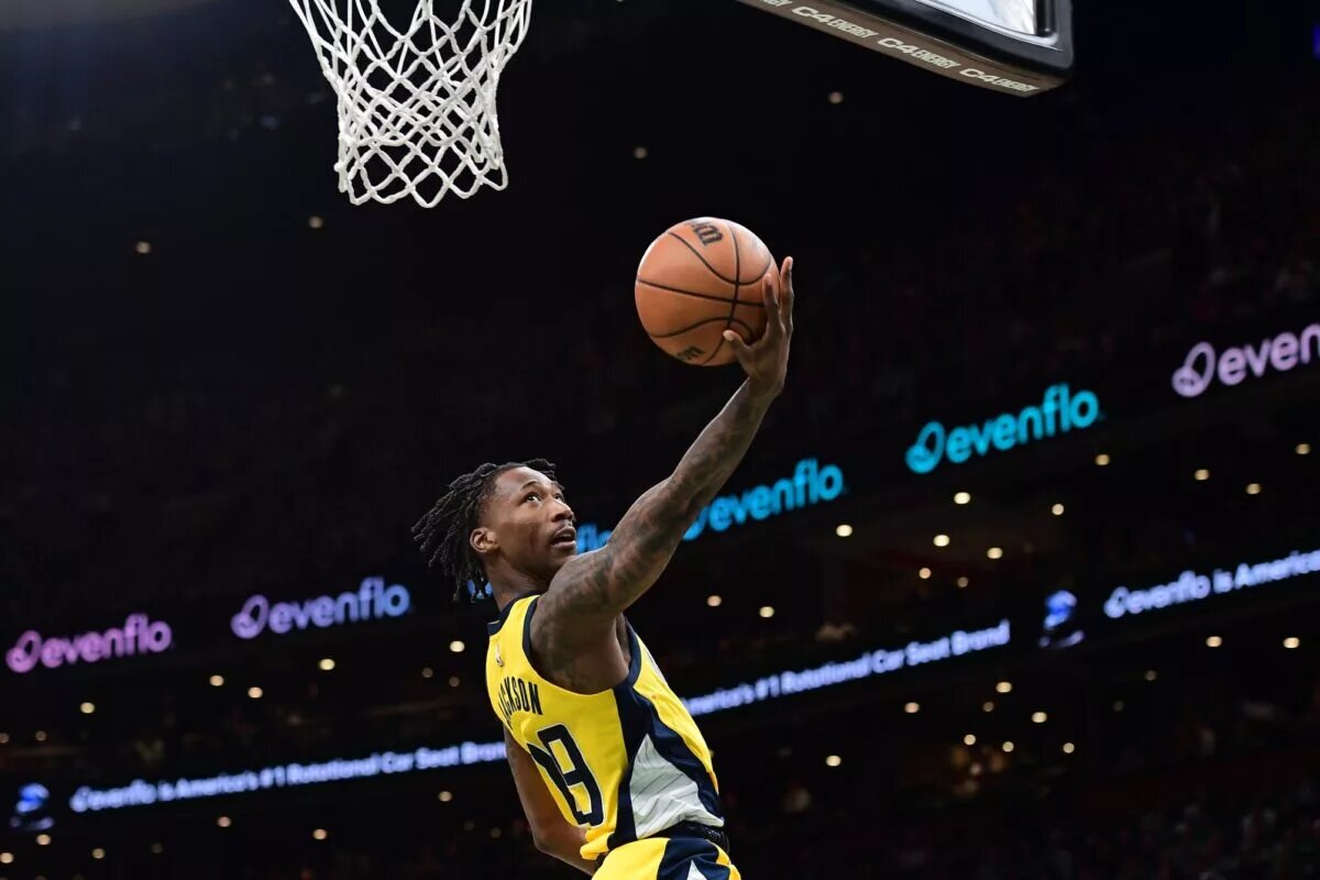 Indiana Pacers guard Quenton Jackson scores an acrobatic layup