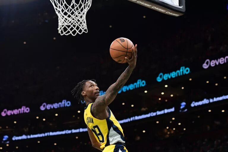 Indiana Pacers guard Quenton Jackson scores an acrobatic layup