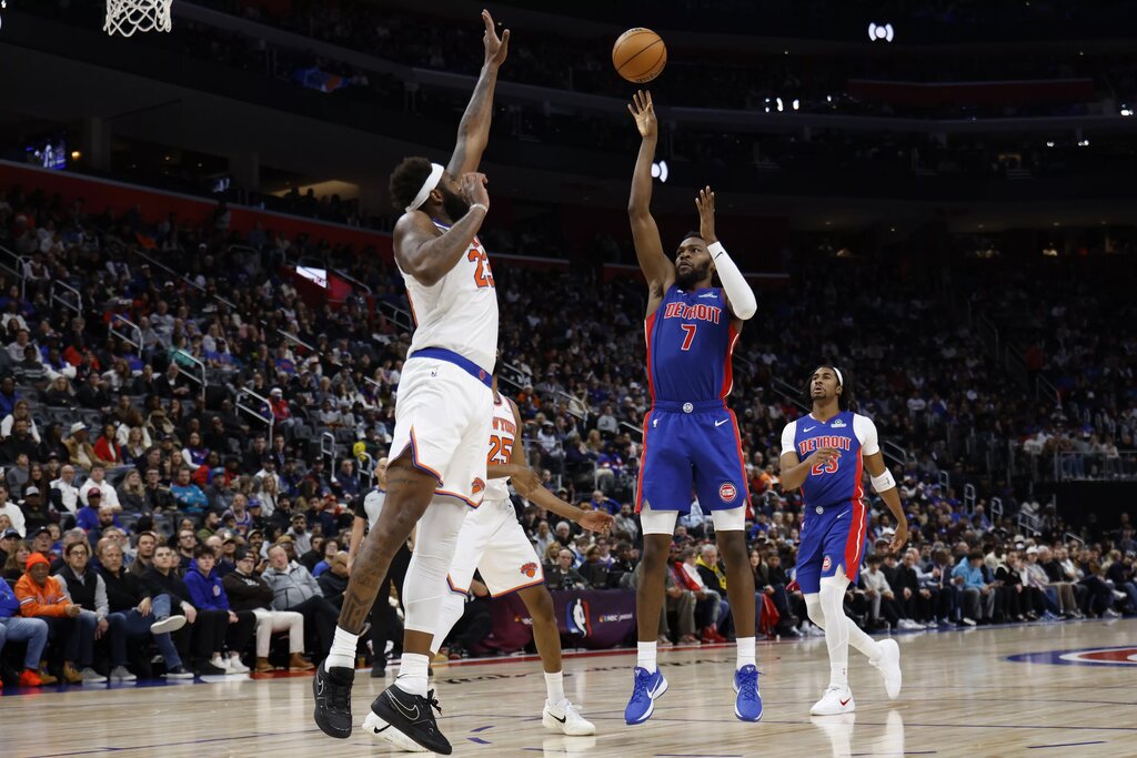 Jan 5, 2026; Detroit, Michigan, USA; Detroit Pistons forward Paul Reed (7) shoots against New York Knicks center Mitchell Robinson (23) in the second half at Little Caesars Arena. Mandatory Credit: Rick Osentoski-Imagn Images