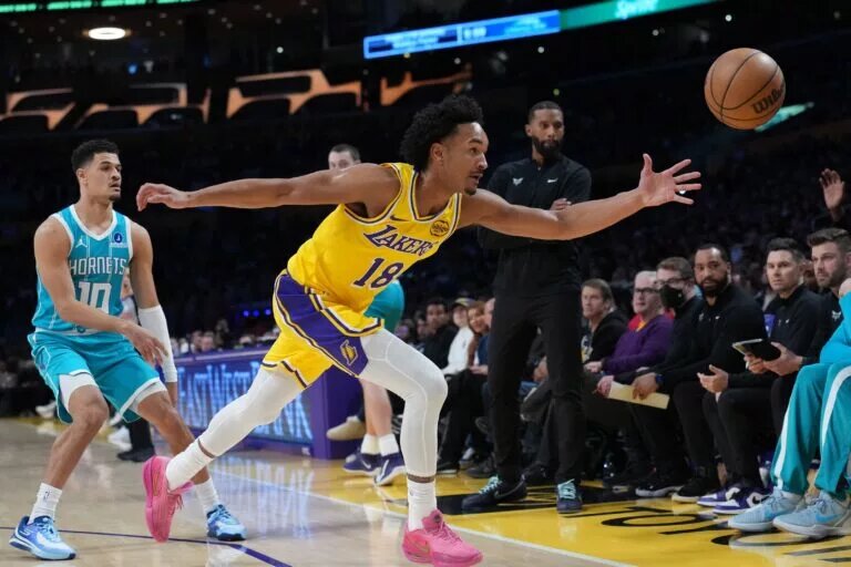 Jan 15, 2026; Los Angeles, California, USA; Los Angeles Lakers guard Kobe Bufkin (18_ pursues the ball against the Charlotte Hornets in the first half at Crypto.com Arena. Mandatory Credit: Kirby Lee-Imagn Images