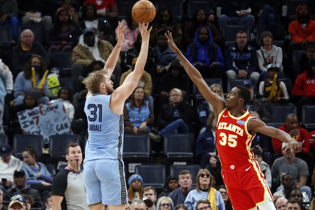 Jan 21, 2026; Memphis, Tennessee, USA; Memphis Grizzlies center Jock Landale (31) shoots for three as Atlanta Hawks center Christian Koloko (35) defends during the second quarter at FedExForum. Mandatory Credit: Petre Thomas-Imagn Images