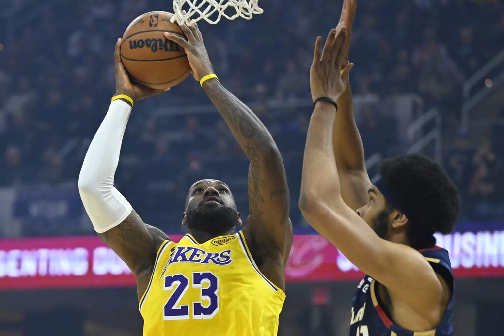 Jan 28, 2026; Cleveland, Ohio, USA; Los Angeles Lakers forward LeBron James (23) shoots beside Cleveland Cavaliers center Jarrett Allen (31) in the first quarter at Rocket Arena. Mandatory Credit: David Richard-Imagn Images