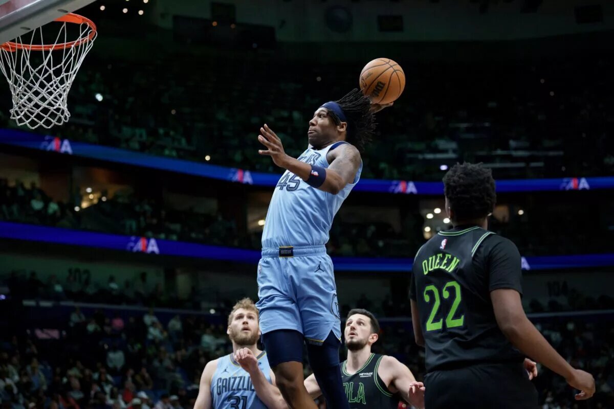 Jan 30, 2026; New Orleans, Louisiana, USA; Memphis Grizzlies forward GG Jackson (45) dunks against New Orleans Pelicans center Derik Queen (22) during the first half at Smoothie King Center. Mandatory Credit: Matthew Hinton-Imagn Images