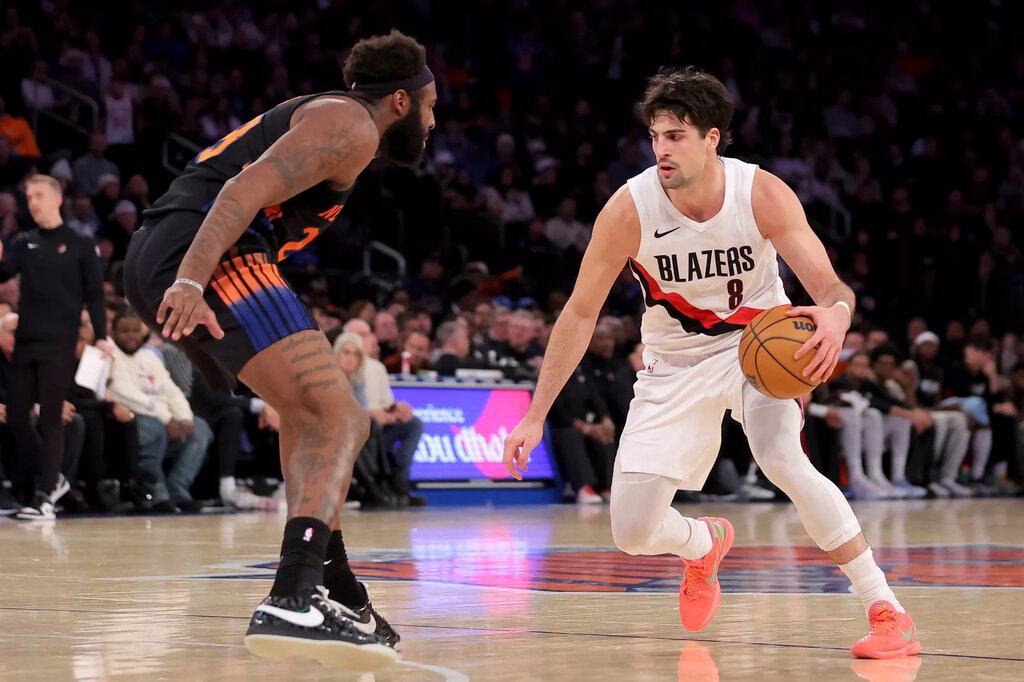Portland Trail Blazers forward Deni Avdija (8) controls the ball against New York Knicks center Mitchell Robinson (23) during the fourth quarter at Madison Square Garden.