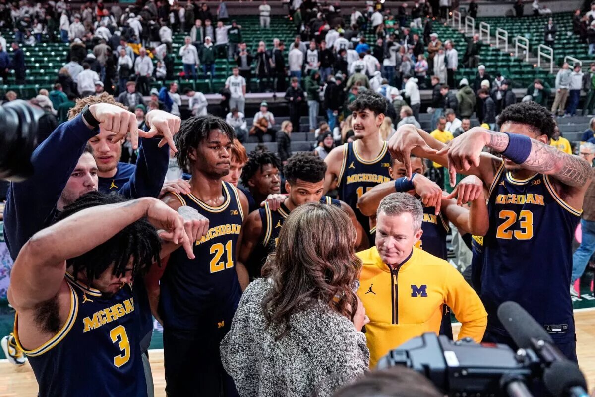 Dusty May and his Michigan team celebrate after a massive win on the road