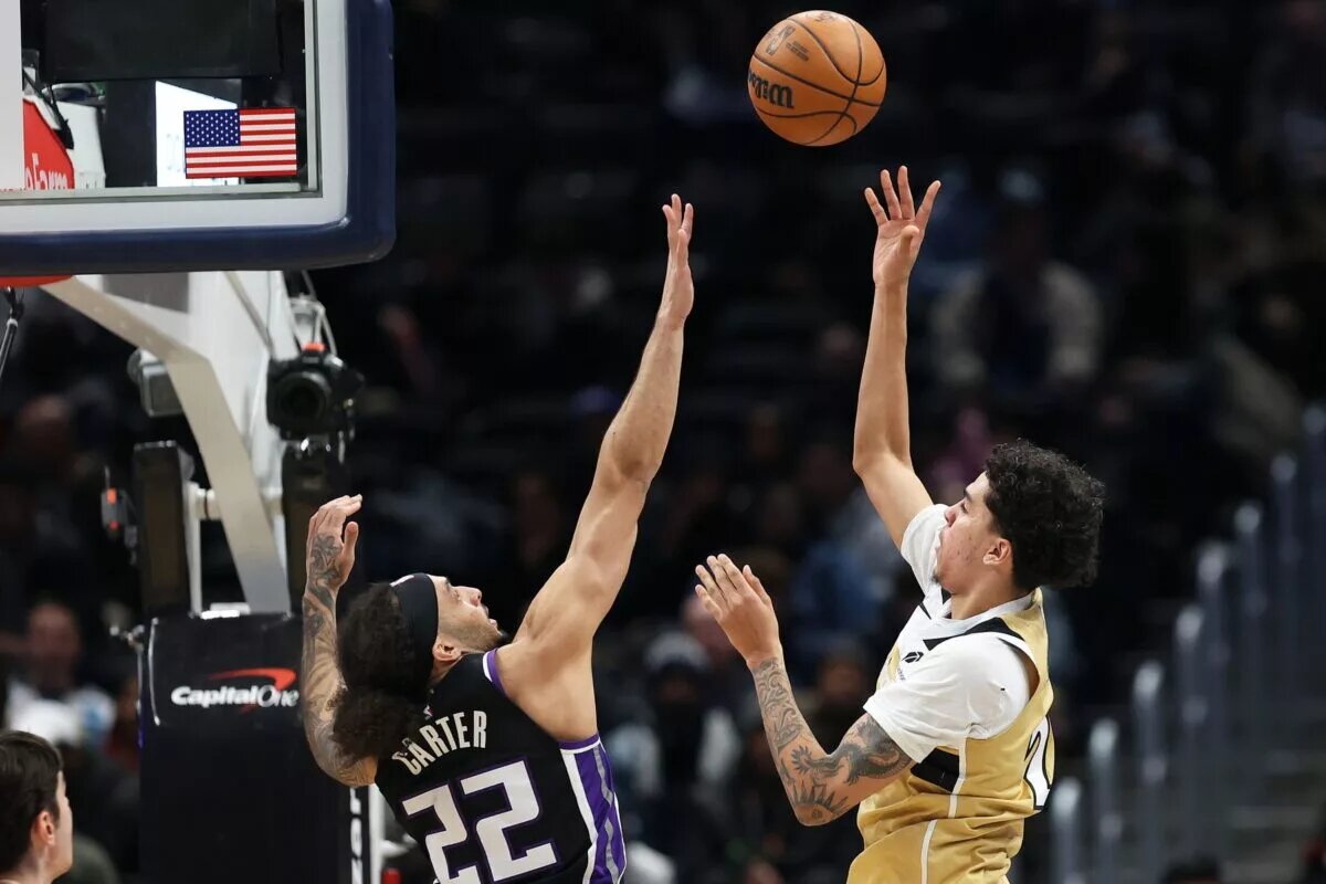 Feb 1, 2026; Washington, District of Columbia, USA; Washington Wizards guard Will Riley (27) takes a shot over Sacramento Kings guard Devin Carter (22) during the second half at Capital One Arena. Mandatory Credit: Daniel Kucin Jr.-Imagn Images