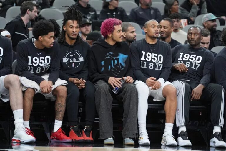 Feb 1, 2026; San Antonio, Texas, USA; San Antonio Spurs forward Jeremy Sochan (10) on the bench between guard Stephon Castle (5) and forward Keldon Johnson (3) in the second half against the Orlando Magic at Frost Bank Center. Mandatory Credit: Daniel Dunn-Imagn Images