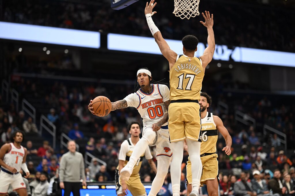 Knicks guard Jordan Clarkson (00) attempts a pass in front of Washington Wizards center Skal Labissiere (17) during the fourth quarter at Capital One Arena.