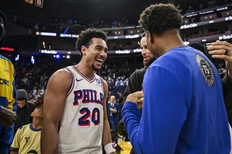 Philadelphia 76ers guard Jared McCain (20) smiles post game after defeating the Golden State Warriors at Chase Center.