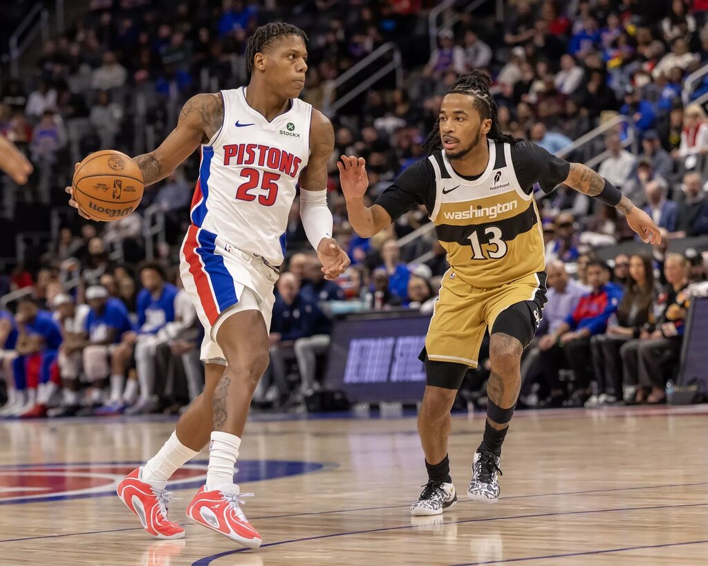  Washington Wizards guard Sharife Cooper (13) defends Detroit Pistons guard Marcus Sasser (25) during the second half at Little Caesars Arena.