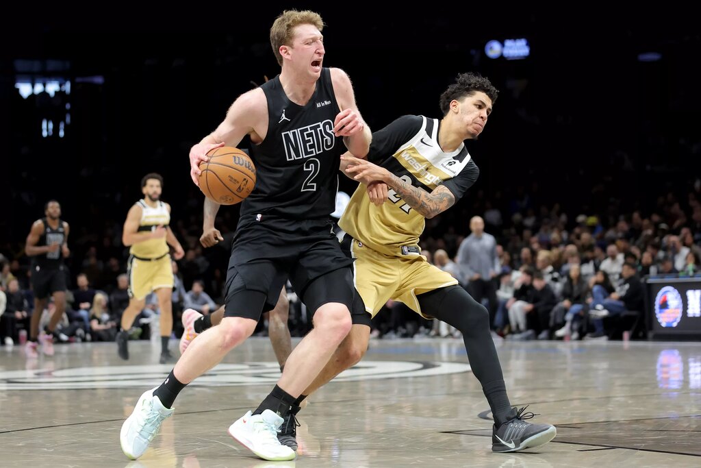 Brooklyn Nets forward Danny Wolf (2) drives to the basket against Washington Wizards guard Will Riley (27) during the fourth quarter at Barclays Center.
