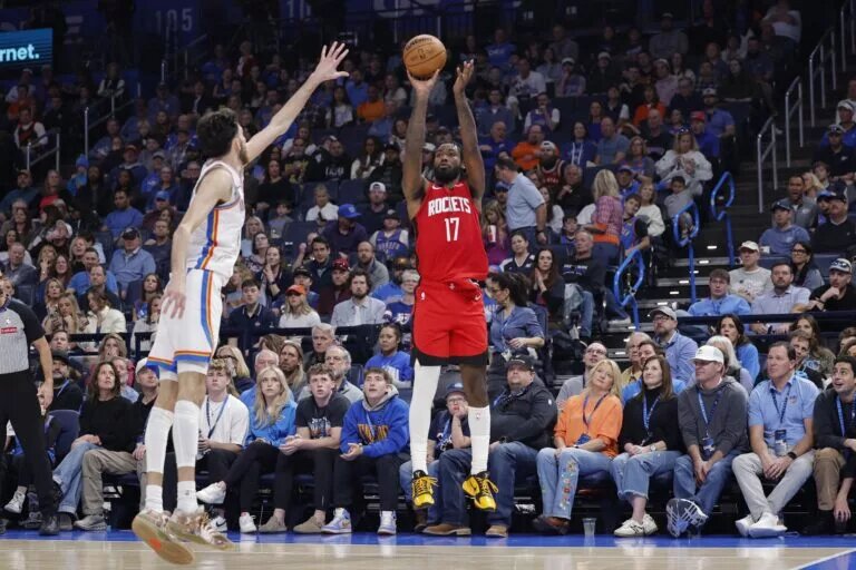 Rockets player Tari Eason attempts a three versus the Thunder.
