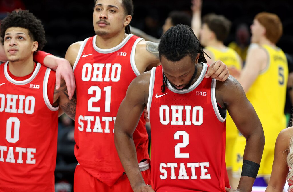 Ohio State's Bruce Thronton (No. 2), and his teammates react to the Buckeyes loss to Michigan.