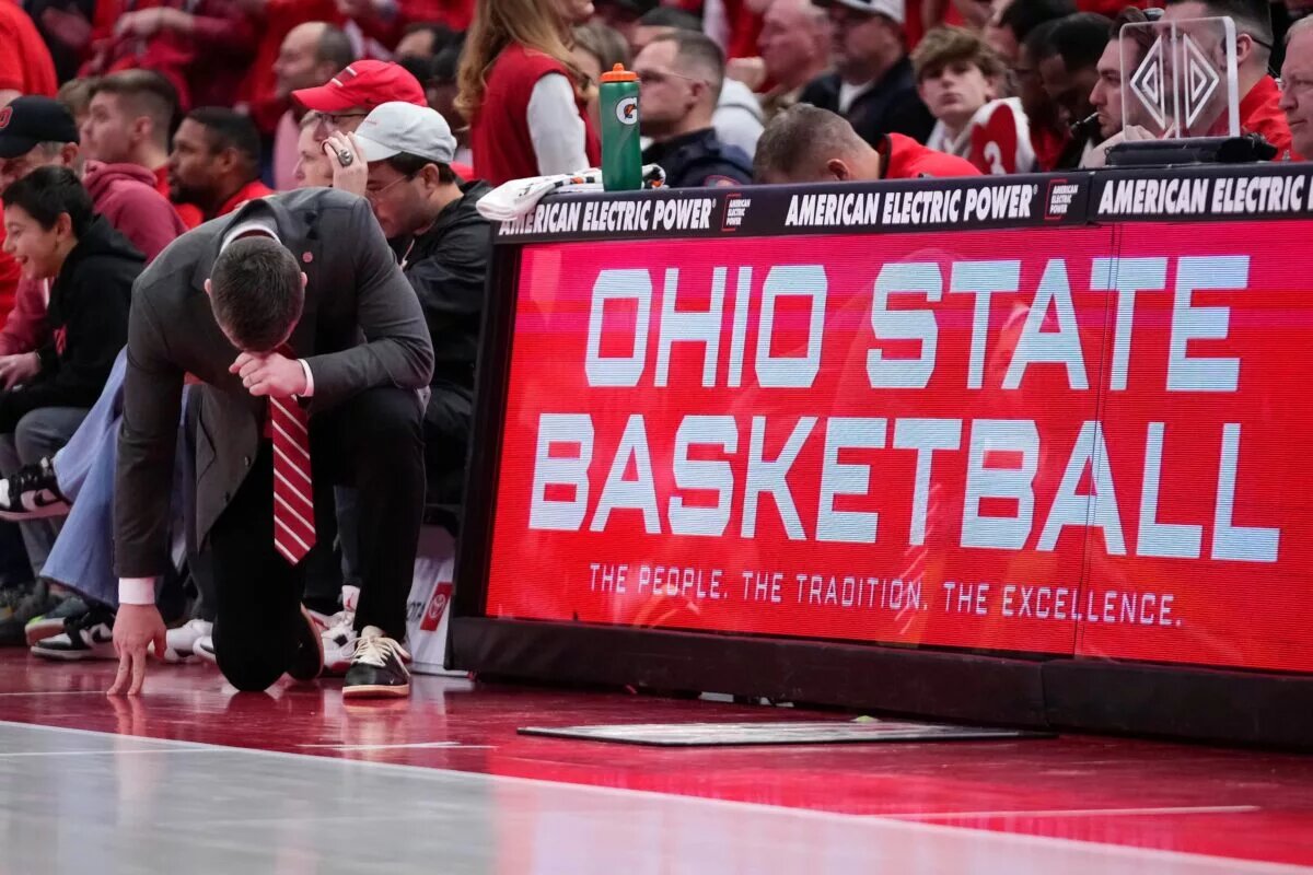 Ohio State's Jake Diebler takes a knee during the Buckeyes game against Michigan.