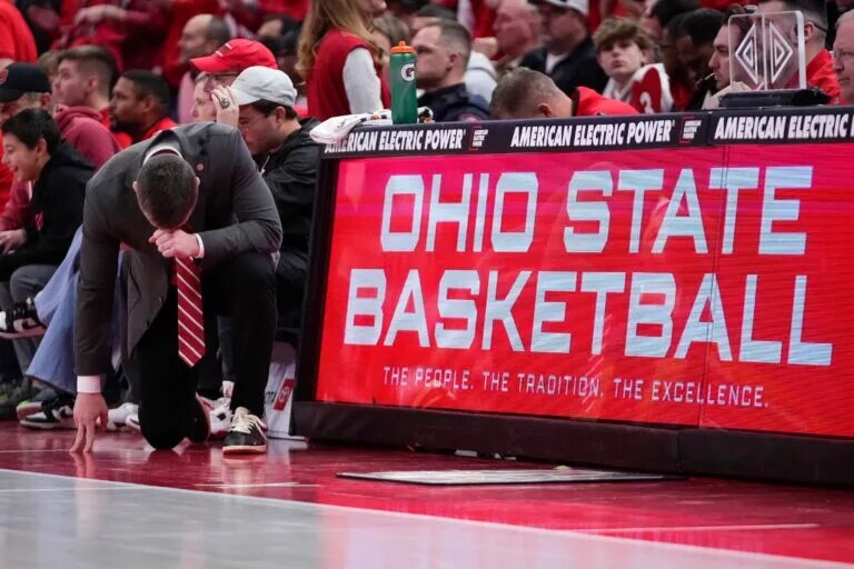 Ohio State's Jake Diebler takes a knee during the Buckeyes game against Michigan.
