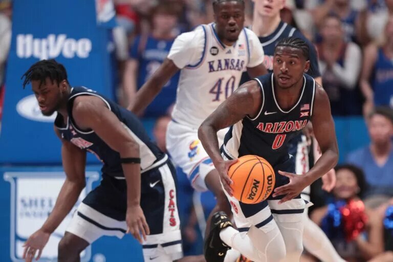 Arizona Wildcats guard Jaden Bradley (0) catches a rebound against Kansas Jayhawks during the game inside Allen Fieldhouse on Feb. 9, 2026.