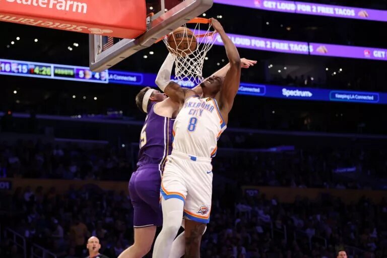 Feb 9, 2026; Los Angeles, California, USA; Oklahoma City Thunder guard Jalen Williams (8) dunks the ball over Los Angeles Lakers guard Austin Reaves (15) during the first half at Crypto.com Arena. Mandatory Credit: Kiyoshi Mio-Imagn Images
