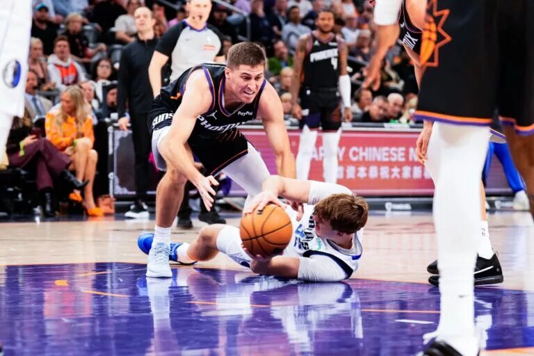Phoenix Suns guard tries to steal ball from Dallas Mavericks forward Cooper Flagg