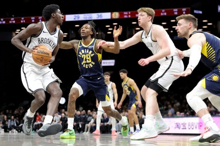 Indiana Pacers guard Quenton Jackson plays defense against Brooklyn Nets wing Drake Powell