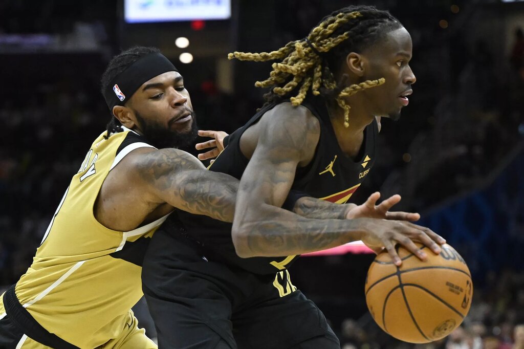 Feb 11, 2026; Cleveland, Ohio, USA; Washington Wizards guard Jaden Hardy (8) defends Cleveland Cavaliers guard Keon Ellis (14) in the fourth quarter at Rocket Arena. Mandatory Credit: David Richard-Imagn Images