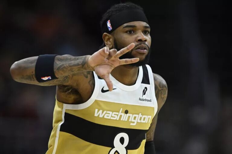 Feb 11, 2026; Cleveland, Ohio, USA; Washington Wizards guard Jaden Hardy (8) celebrates his three-point basket in the fourth quarter against the Cleveland Cavaliers at Rocket Arena. Mandatory Credit: David Richard-Imagn Images