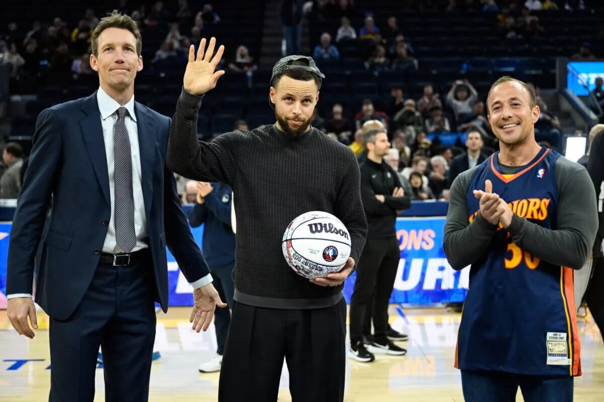 Feb 11, 2026; San Francisco, California, USA; Golden State Warriors guard Stephen Curry, center, accepts a ball honoring his All-Star Game selection from Golden State Warriors general manager Mike Dunleavy, left, and 12-year season ticket member Casey Kaminsky, right, before the game against the San Antonio Spurs at Chase Center. Mandatory Credit: Eakin Howard-Imagn Images
