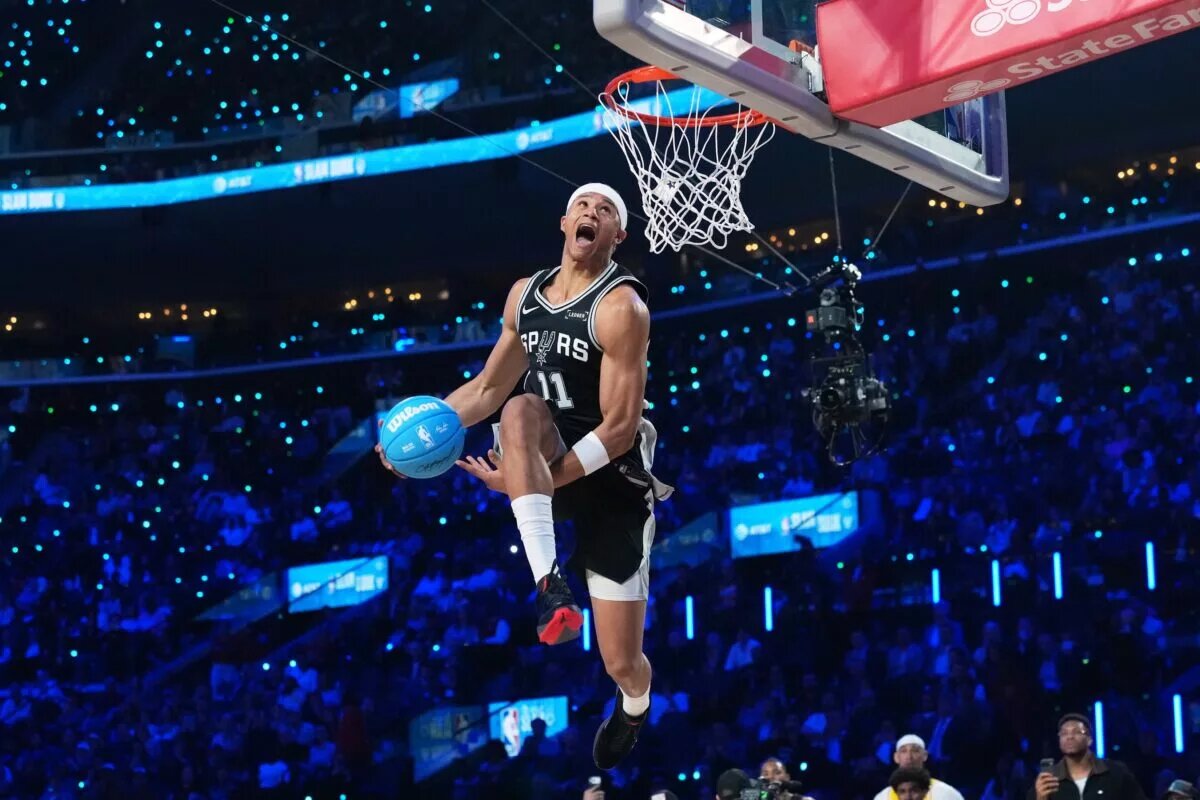 Feb 14, 2026; Los Angeles, CA, USA; San Antonio Spurs forward Carter Bryant (11) competes in the slam dunk contest during the 2026 NBA All Star Saturday Night at Intuit Dome. Mandatory Credit: Kirby Lee-Imagn Images
