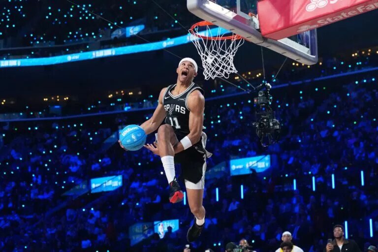 Feb 14, 2026; Los Angeles, CA, USA; San Antonio Spurs forward Carter Bryant (11) competes in the slam dunk contest during the 2026 NBA All Star Saturday Night at Intuit Dome. Mandatory Credit: Kirby Lee-Imagn Images