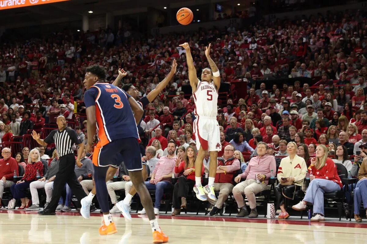 Arkansas Razorbacks guard Darius Acuff Jr (5) shoots a three-point shot during the first half against the Auburn Tigers at Bud Walton Arena.