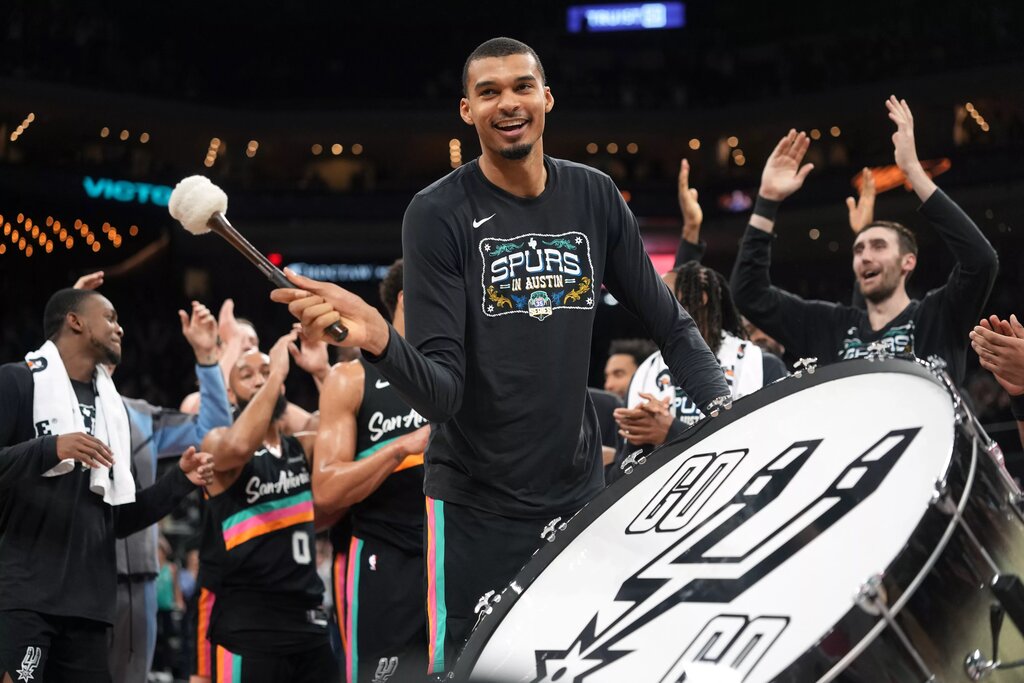 Feb 19, 2026; Austin, Texas, USA; San Antonio Spurs forward Victor Wembanyama (1) leads the crowd in a cheer after a victory over the Phoenix Suns at Moody Center. Mandatory Credit: Scott Wachter-Imagn Images