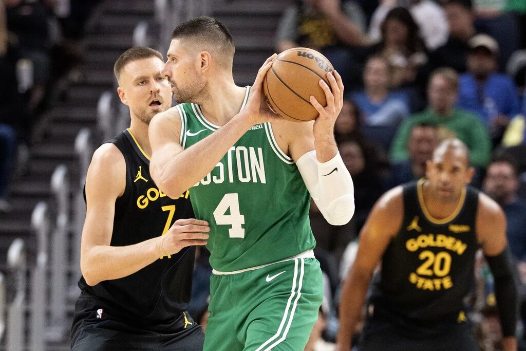 Feb 19, 2026; San Francisco, California, USA; Golden State Warriors center Kristaps Porzingis (7) guards Boston Celtics center Nikola Vucevic (4) during the third quarter at Chase Center. Mandatory Credit: D. Ross Cameron-Imagn Images