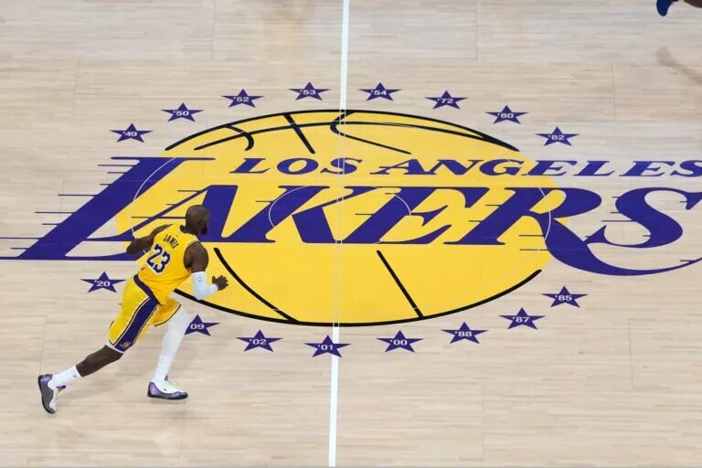 Feb 20, 2026; Los Angeles, California, USA; A general overall view as Los Angeles Lakers forward LeBron James (23) dribbles the ball across the Lakers logo at midcourt against the LA Clippers at the Crypto.com Arena. Mandatory Credit: Kirby Lee-Imagn Images