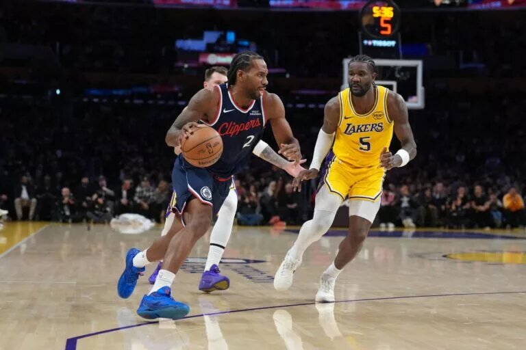 LA Clippers forward Kawhi Leonard (2) dribbles the ball against Los Angeles Lakers center Deandre Ayton (5) in the second half at Crypto.com Arena.
