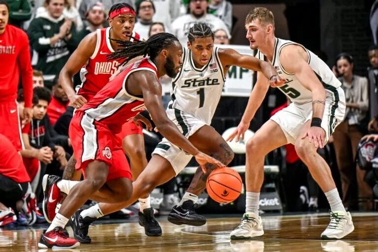Ohio State's Bruce Thornton tries to drive against Michigan State