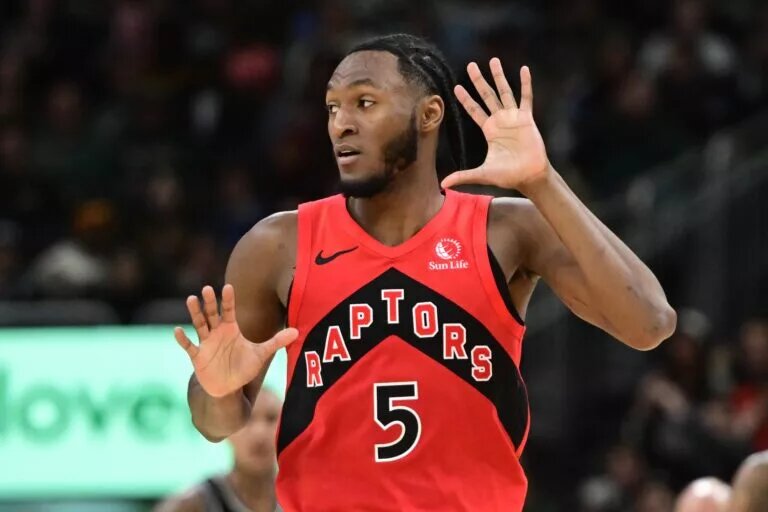 Toronto Raptors guard Immanuel Quickley (5) reacts after scoring a 3-point basket against the Milwaukee Bucks in the third quarter at Fiserv Forum.
