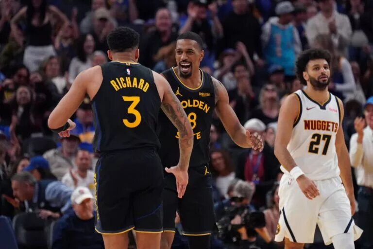 Feb 22, 2026; San Francisco, California, USA; Golden State Warriors guard De'Anthony Melton (8) celebrates with guard Will Richard (3) as Denver Nuggets guard Jamal Murray (27) looks on in the fourth quarter at Chase Center. Mandatory Credit: David Gonzales-Imagn Images