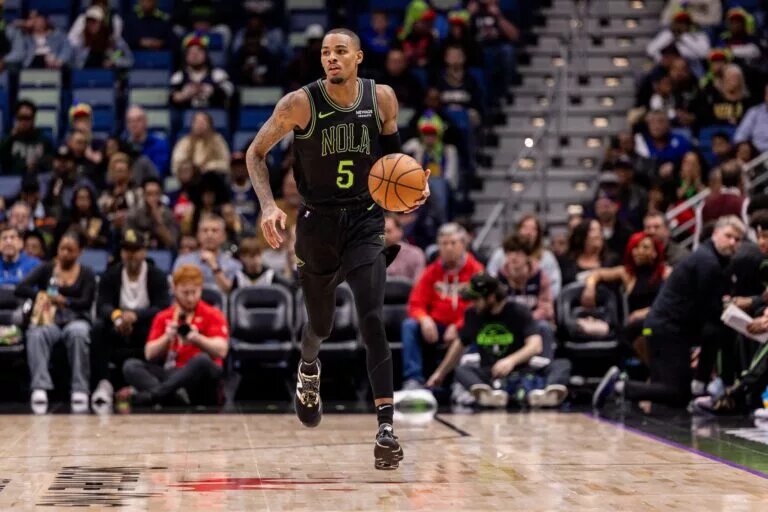 New Orleans Pelicans guard Dejounte Murray dribbles up the court