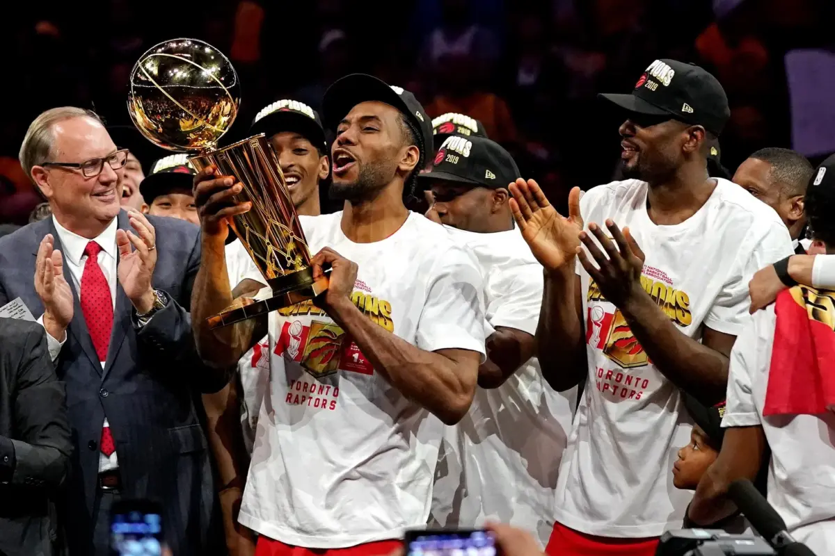 Jun 13, 2019; Oakland, CA, USA; Toronto Raptors forward Kawhi Leonard (2) celebrates with the Larry O'Brien Trophy after the Golden State Warriors in game six of the 2019 NBA Finals at Oracle Arena. Mandatory Credit: Kyle Terada-Imagn Images